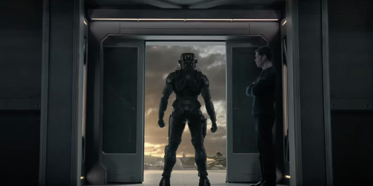 A Spartan stands in front of opening doors in Halo season 2