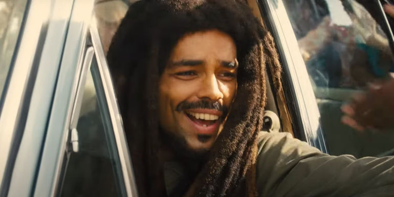 Bob Marley in the car in the movie Bob Marley One Love