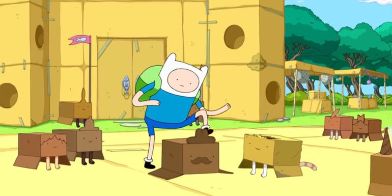 Finn in a cardboard kingdom, with cats in boxes. (Adventure Time)