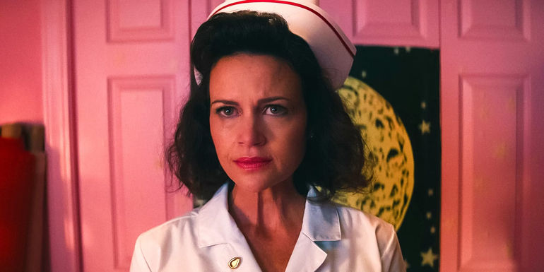 Carla Gugino as Janet wearing a nurse outfit in Lisa's bedroom in Lisa Frankenstein
