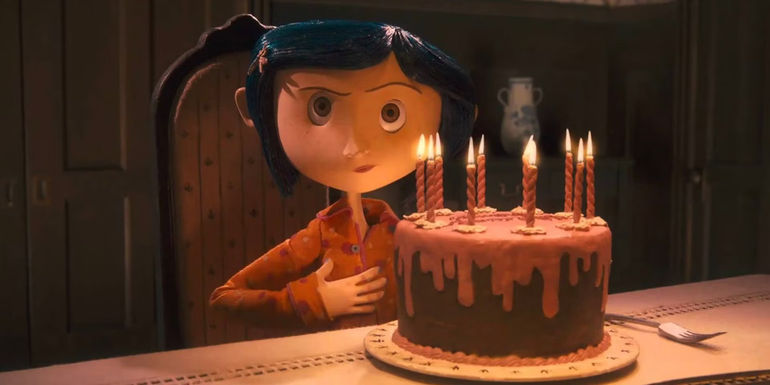 Coraline with a birthday cake in coraline