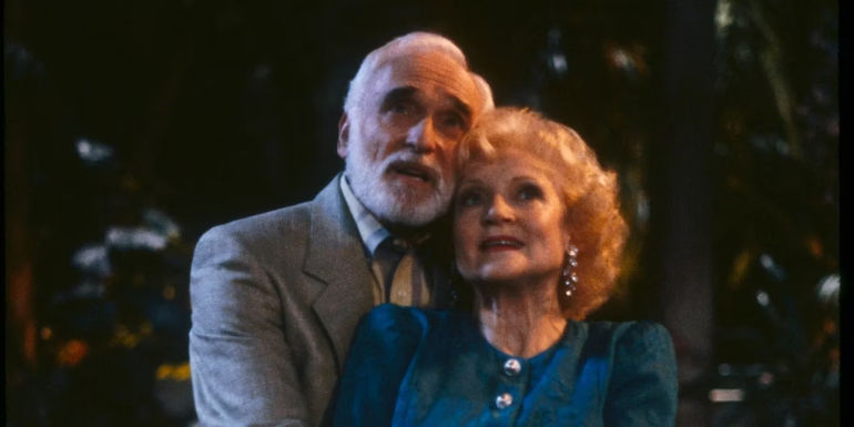Rose (Betty White) and Miles (Harold Gould) embrace in The Golden Girls 