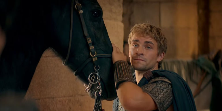 Alexander with his hand on his horse's nose in Alexander: The Making of a God.