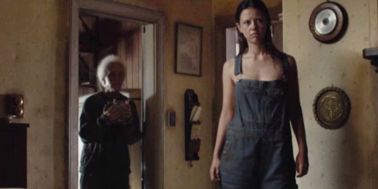 Pearl staring at Maxine in her kitchen in X