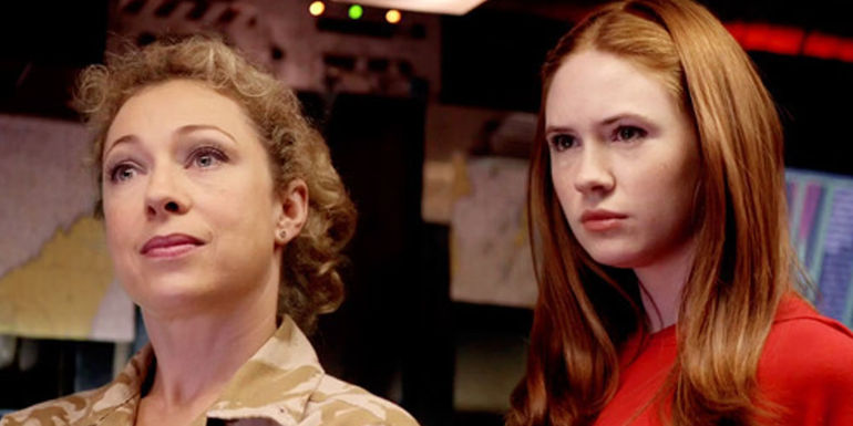 Alex Kingston and Karen Gillan as River Song and Amy Pond giving strong stares in Doctor Who's The Time of Angels