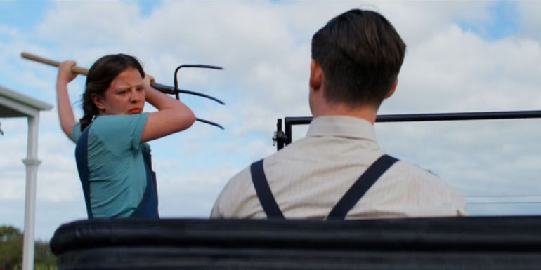 Mia Goth holding a pitchfork in Pearl (2022)