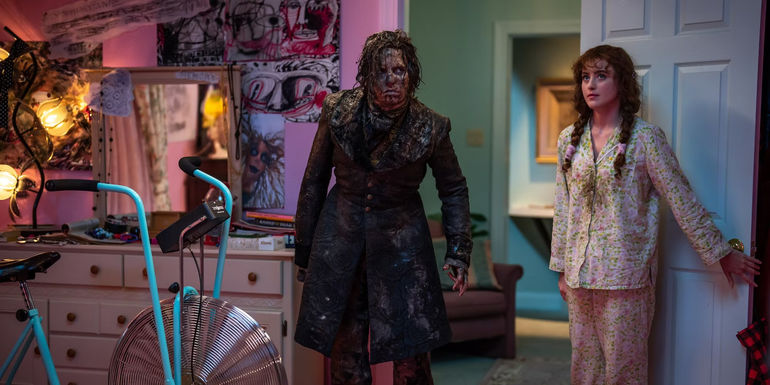 The Creature and Lisa stand in Lisa's bedroom in Lisa Frankenstein