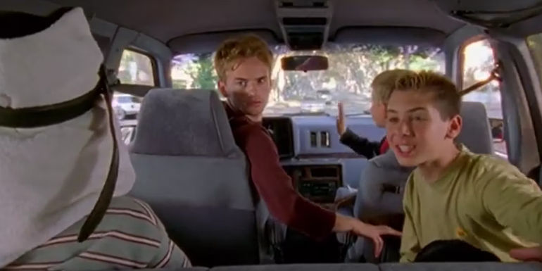 Francis driving in reverse with Malcolm, Reese, and Dewey in the car