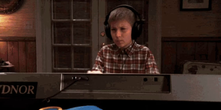 Dewey playing a keyboard while wearing headphones in Malcolm in the Middle