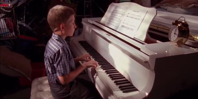 Dewey playing a white piano in Malcolm in the Middle