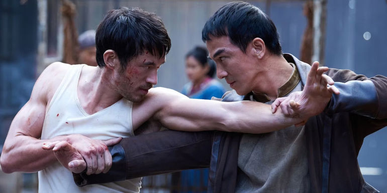 Andrew Koji as Ah Sahm fights a rival Tong member in Warrior