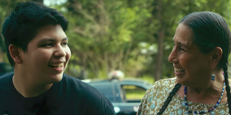 Cheese (Lane Factor) and his grandma smiling in Reservation Dogs.