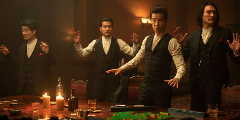 Jason Tobin, Chen Tang and other cast members raise their hands in Warrior season 3