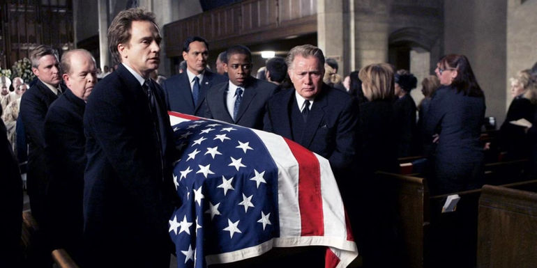 Several characters cahrrying Leo's coffin at his funeral in The West Wing
