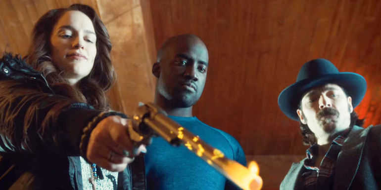 Wynonna pointing her gun next to Deputy Marshal and Doc Holliday