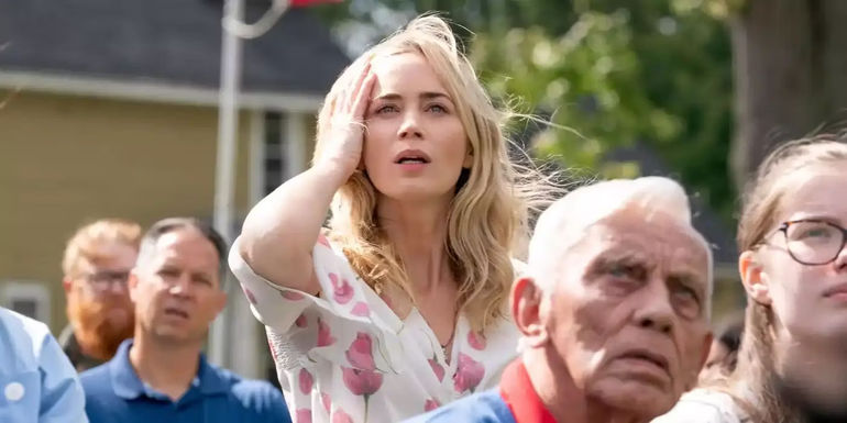 Emily Blunt and a crowd of people looking up in A Quiet Place Day One