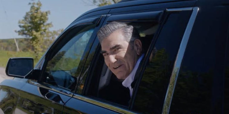 Johnny looks out of a car window in Schitt's Creek