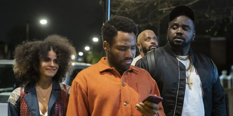 Donald Glover walks with Zazie Beetz and Bryan Tyree Henry in Atlanta