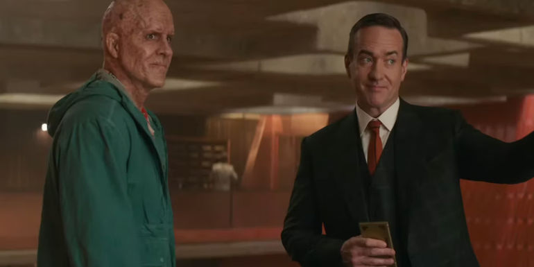 Deadpool (Ryan Reynolds) and Paradox (Matthew Macfadyen) smiling together in Deadpool & Wolverine