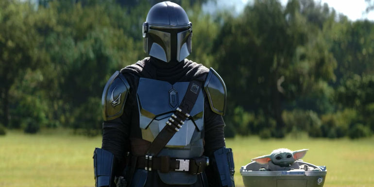 Din Djarin and Grogu stand near the Mandalorians on Plazir-15 in The Mandalorian season 3 episode 6