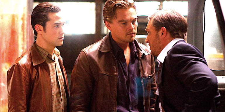 Joseph Gordon Levitt's Arthur and Leonardo DiCaprio's Cobb talk to Tom Hardy's Eames in Inception