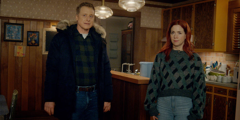 Alan Tudyk as Harry Vanderspeigle standing next to Alice Wetterlund as D'Arcy Bloom in Resident Alien season 3.