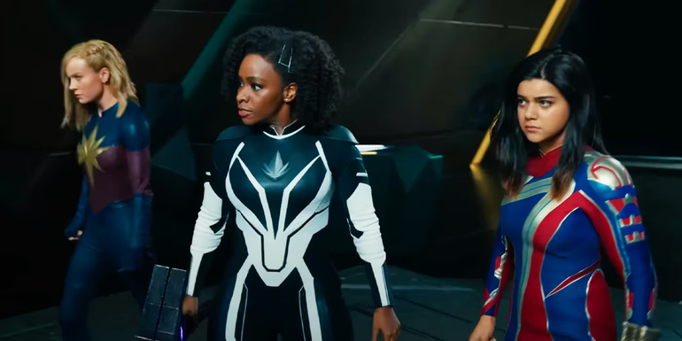 The Marvels' Captain Marvel, Photon, and Ms. Marvel stand together