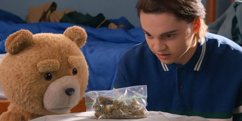Marx Burkholder as John Bennett looking at a bag of weed with Ted in the Ted TV show