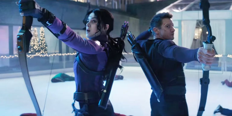 Hailee Steinfeld as Kate Bishop and Jeremy Renner as Clint Barton aiming bows in Hawkeye