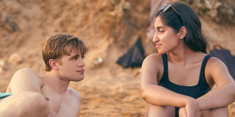 Dex and Em sit on the beach in One Day series