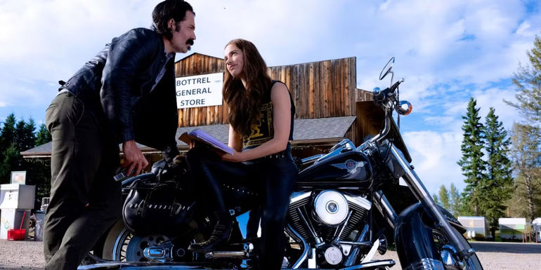 Doc Holliday (Tim Rozon) and Wynonna (Melanie Scorfano) with a motorcycle in the Wynonna Earp finale