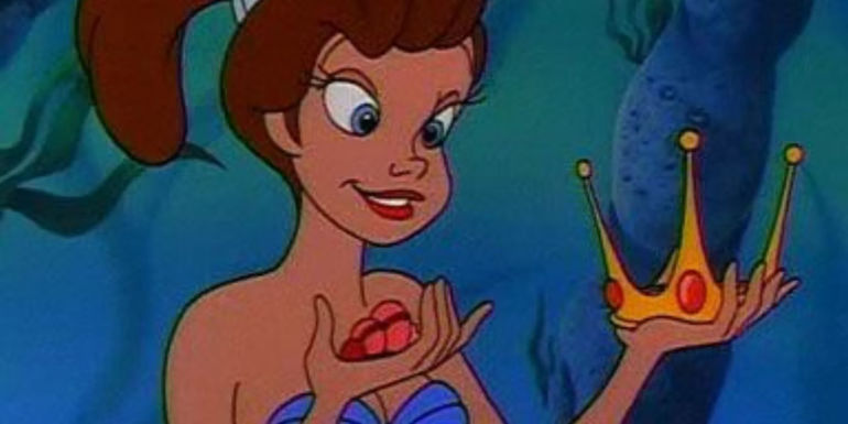 Aquata holds a crown in The Little Mermaid