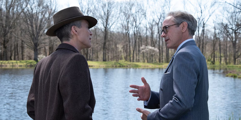 Oppenheimer talking with Strauss next to a pond