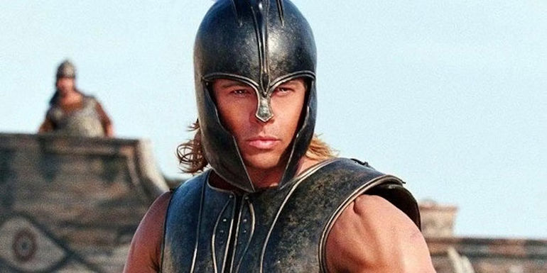 Brad Pitt wearing armor and starring intensely. 