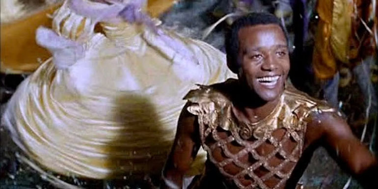 Orfeu smiling while dancing. 