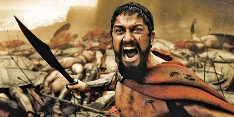 Leonidas wielding a sword and roaring in rage in 300