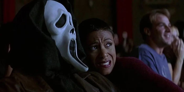 Maureen (Jada Pinkett Smith) leaning up against the Ghostface Killer in Scream 2.