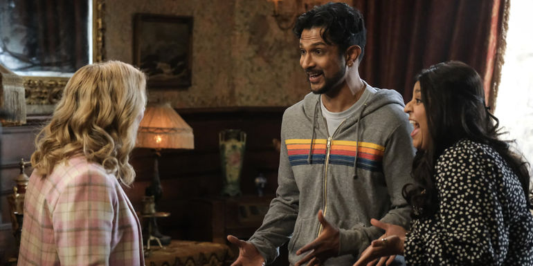 Jay and Bela looking at Sam excitedly in Ghosts season 3.