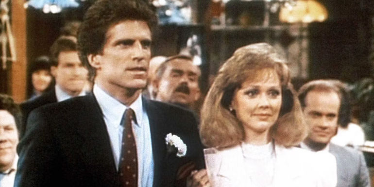 Ted Danson as Sam Malone and Shelley Long as Diane Chambers standing side-by-side in Cheers
