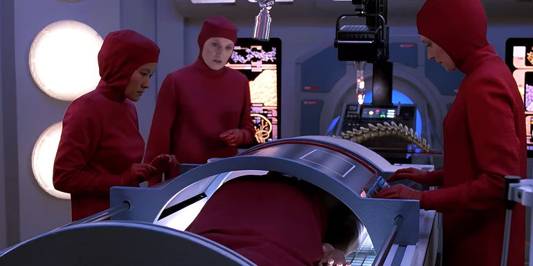 Dr. Crusher performing a medical procedure in Star Trek TNG
