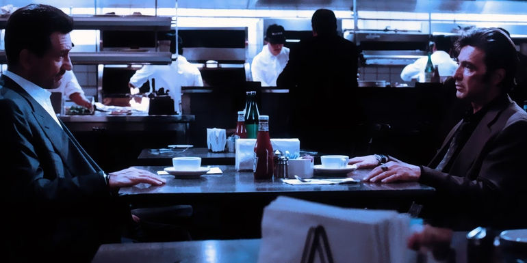 Robert DeNiro and Al Pacino talk over coffee in Heat 