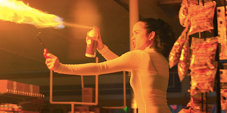 Julia Rehwald's Kate lights an aerosol spray on fire in Fear Street 1994