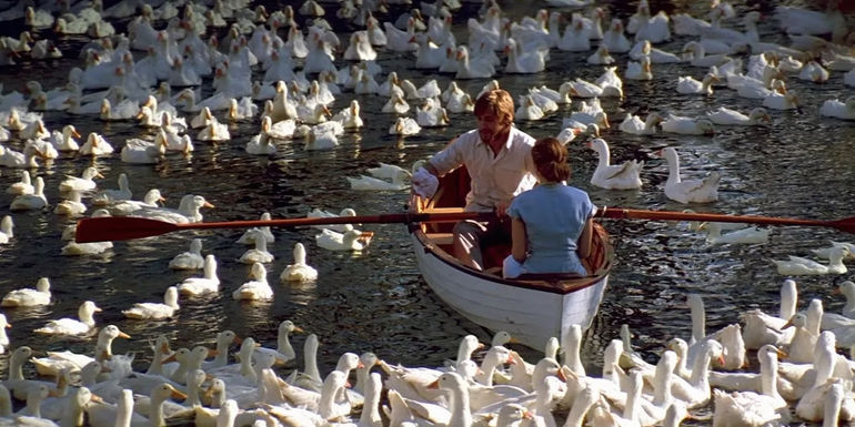 Ryan Gosling and Rachel McAdams rowing a boat in The Notebook