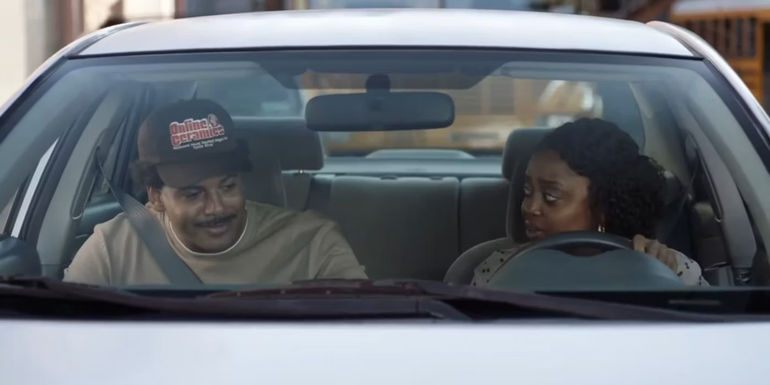 Tariq (Zack Fox) and Janine (Quinta Brunson) driving into work together in Abbott Elementary.