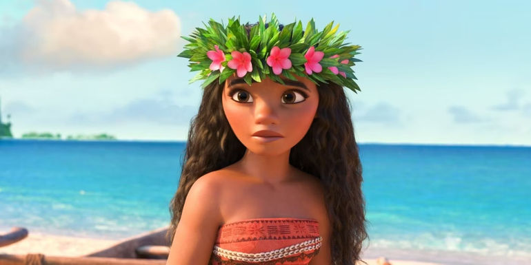 Moana with a flower crown on near the beach in the animated movie Moana
