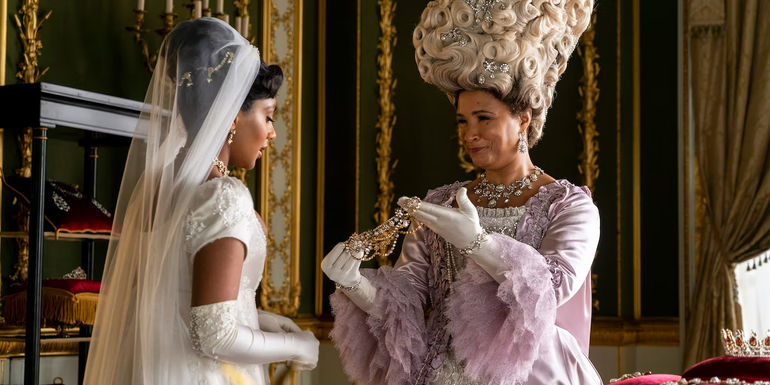 Edwina in Her Wedding Gown While Queen Charlotte Presents Her with Jewelry in Bridgerton Season 2