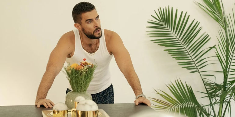 Lance (Josh Segarra) looks serious while leaning against a counter in The Other Two.