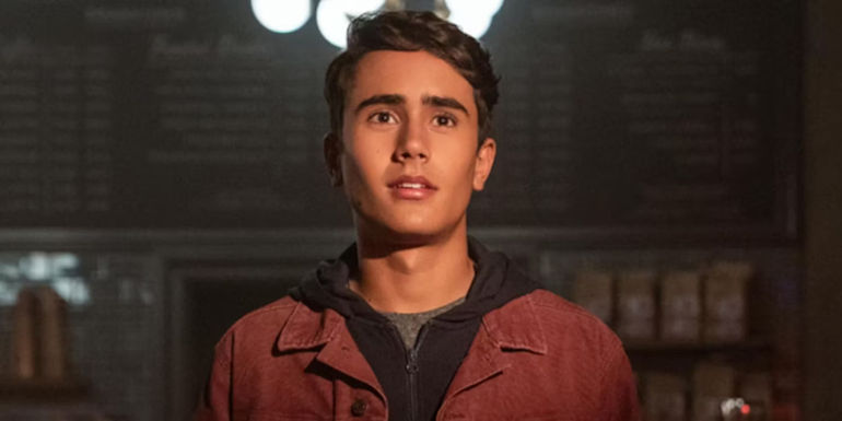 Michael Cimino stands in a room in a scene from Love, Victor.