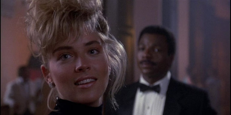 Sharon Stone as Patrice Dellaplane and Carl Weathers in Action Jackson