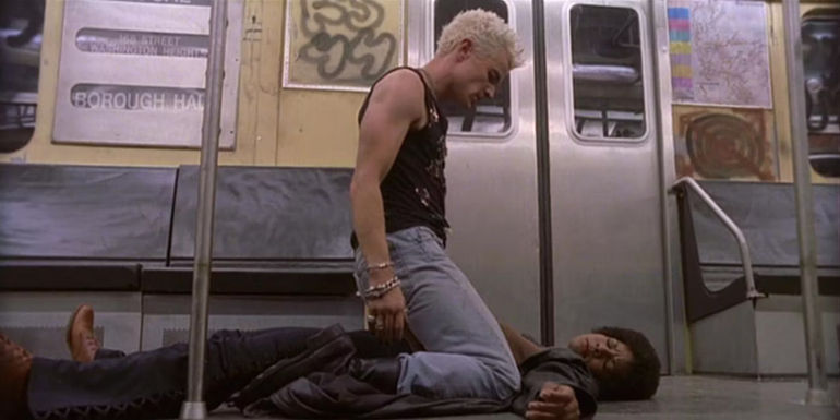 Spike straddling a woman in Buffy
